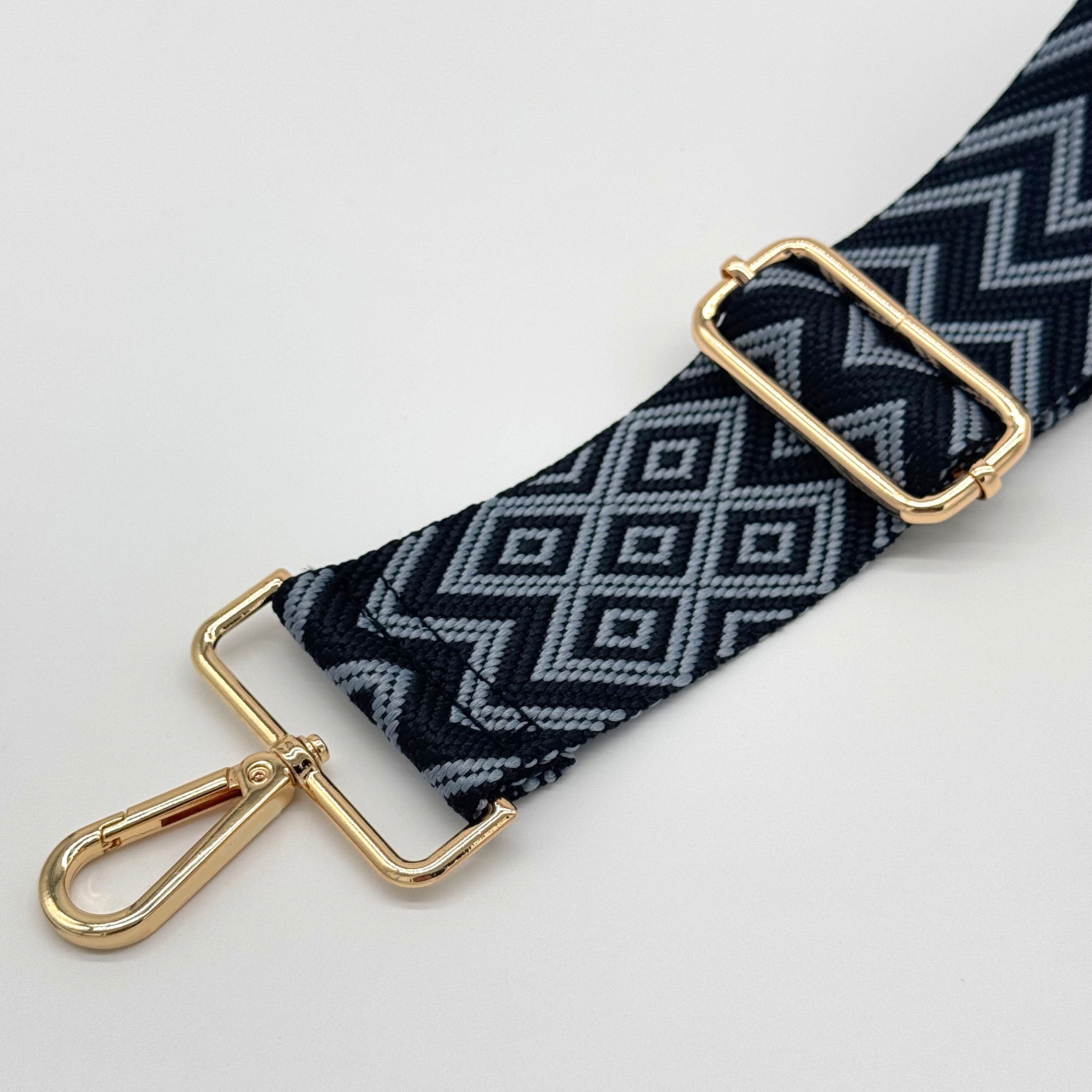 Schwarzer und blauer Zickzack-Taschenriemen