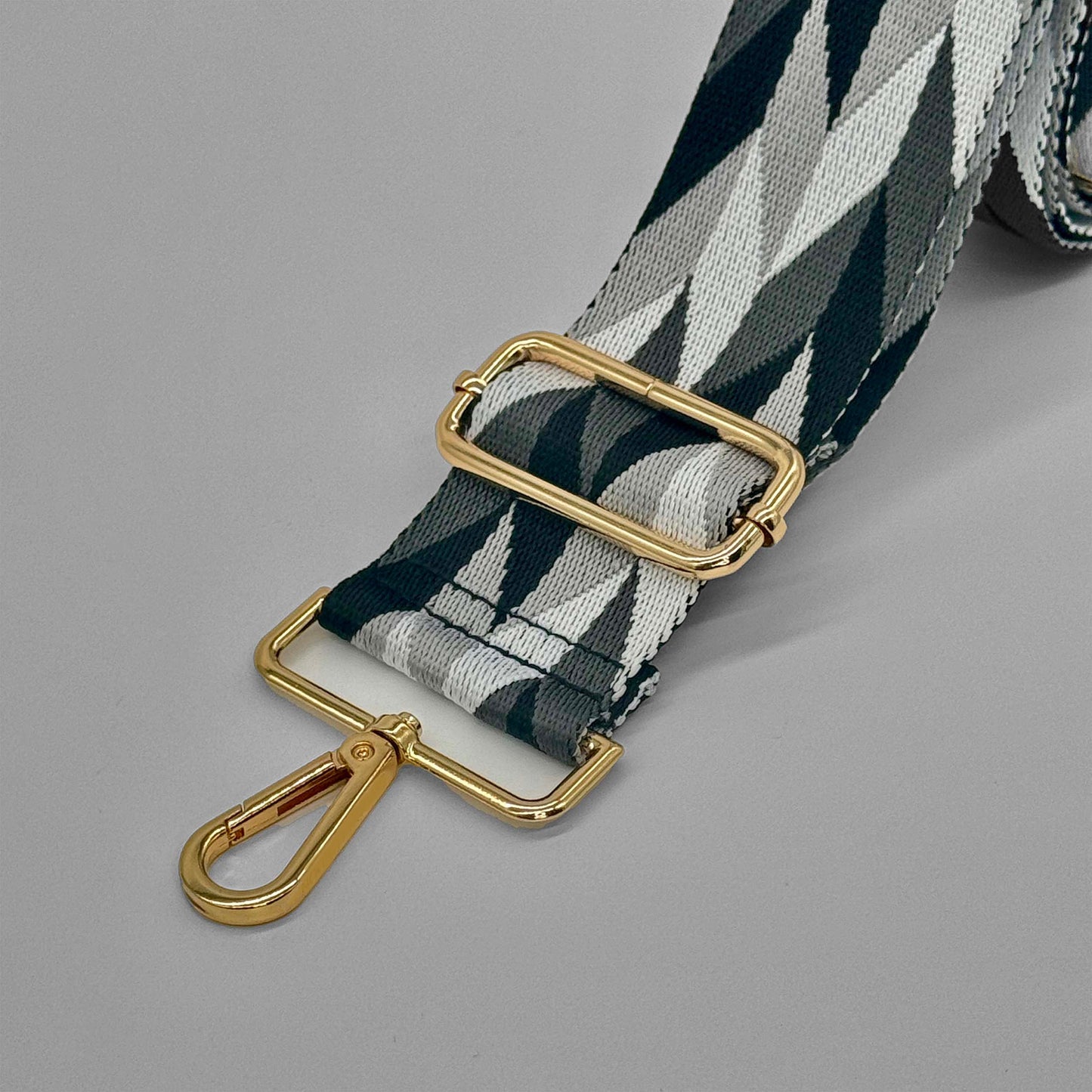 Grauer und schwarzer abstrakter Taschenriemen